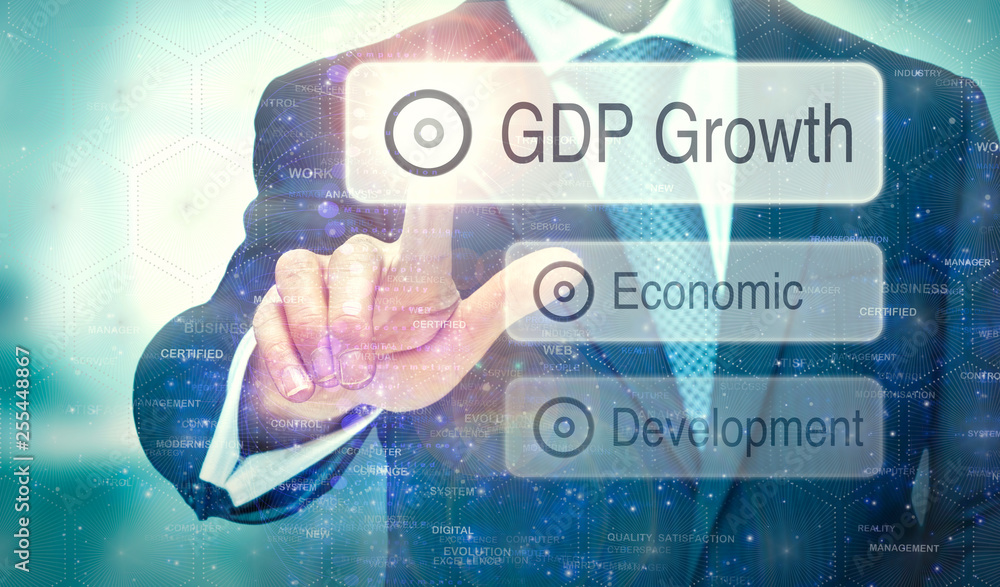 A business man selection a button on a futuristic display with a GDP Growth concept written on it. A business man selection a button on a futuristic display with a GDP Growth concept written on it.
