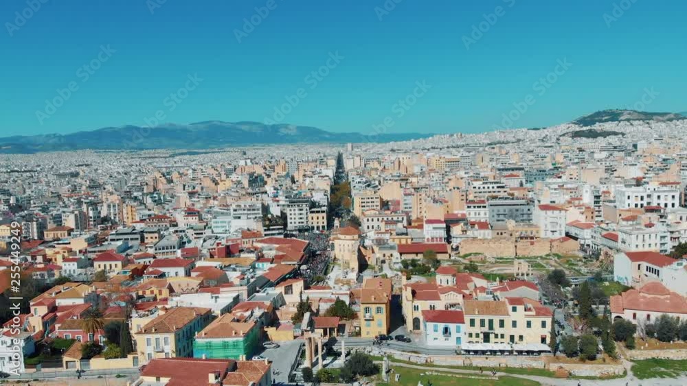 City views of day time with acropolis on a hill at the horizon, Athens, Greece City views of day time with acropolis on a hill at the horizon, Athens, Greece