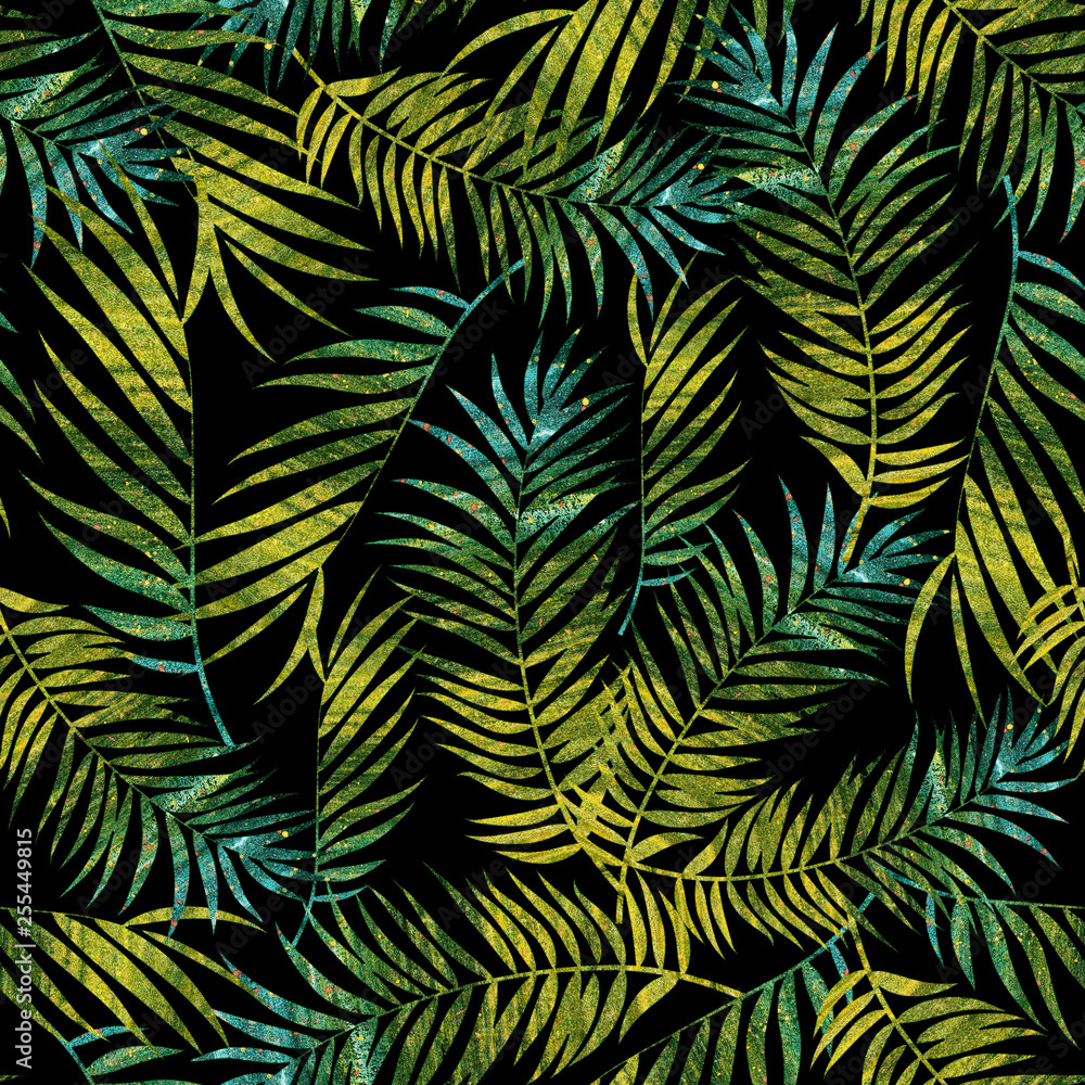 tropical leaves with green and blue colors textures on a dark gray background