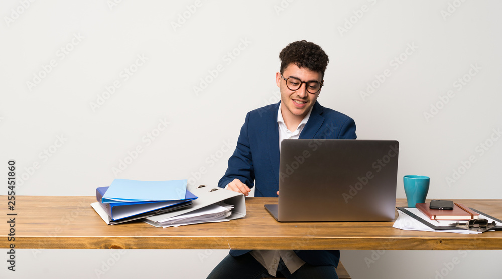 Business man in a office with glasses and happy Business man in a office with glasses and happy