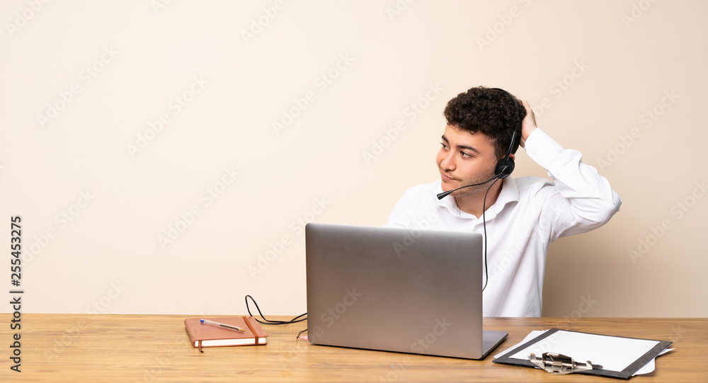 Telemarketer man having doubts while scratching head Telemarketer man having doubts while scratching head
