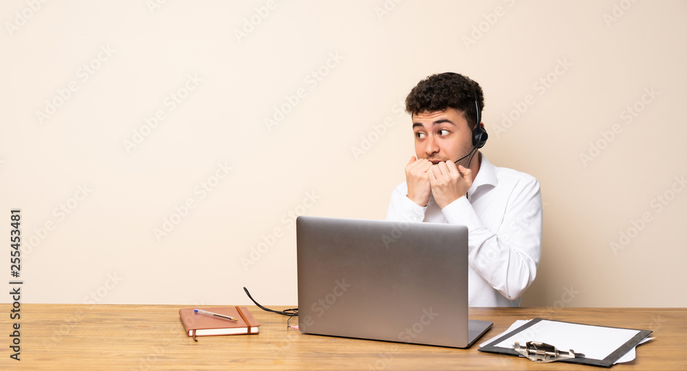 Telemarketer man nervous and scared putting hands to mouth Telemarketer man nervous and scared putting hands to mouth
