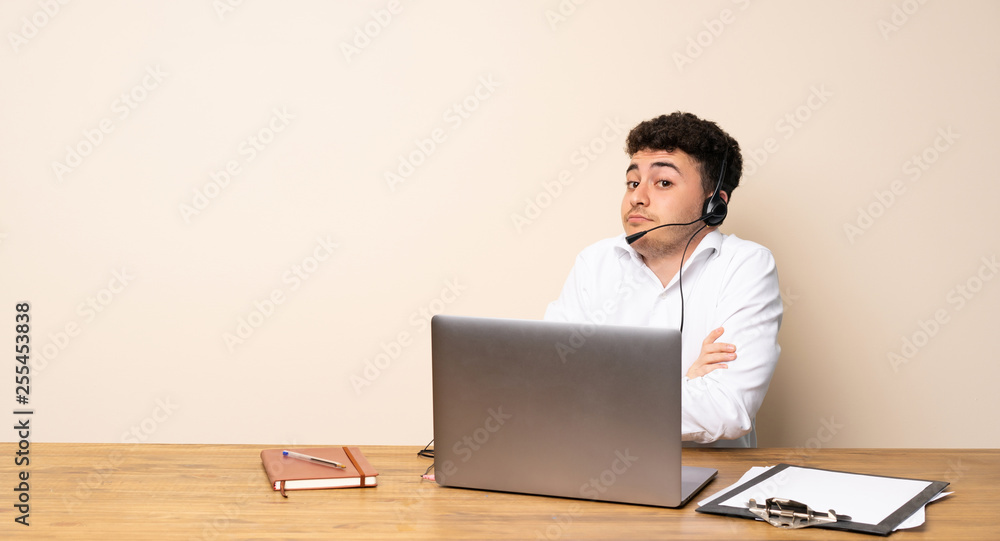 Telemarketer man making doubts gesture while lifting the shoulders Telemarketer man making doubts gesture while lifting the shoulders