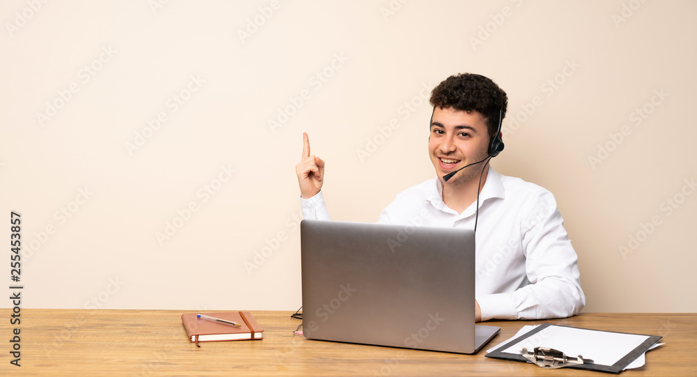 Telemarketer man showing and lifting a finger in sign of the best Telemarketer man showing and lifting a finger in sign of the best