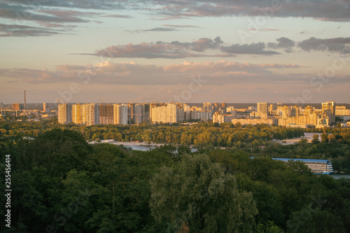 Sunset view of Kiev city from roof at evening. Kyiv  Ukraine
