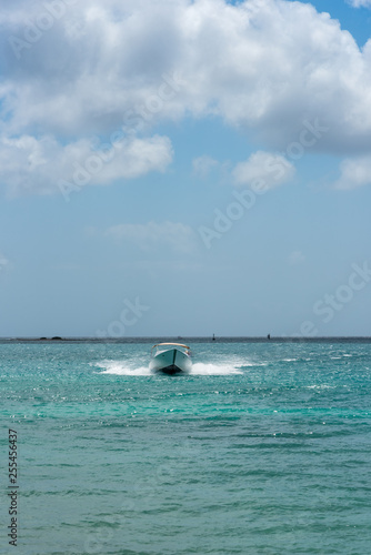 Tourism boat at full speed in the Caribbean Sea. Aruba