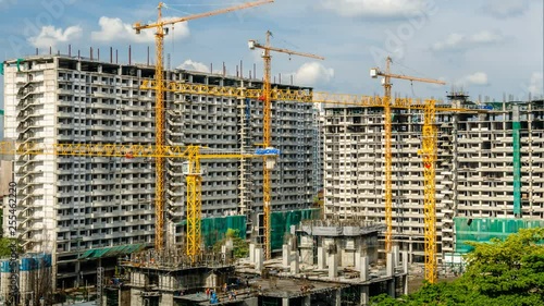 Wallpaper Mural 4k timelapse of construction site. Cranes working on construct building over blue sky. Torontodigital.ca