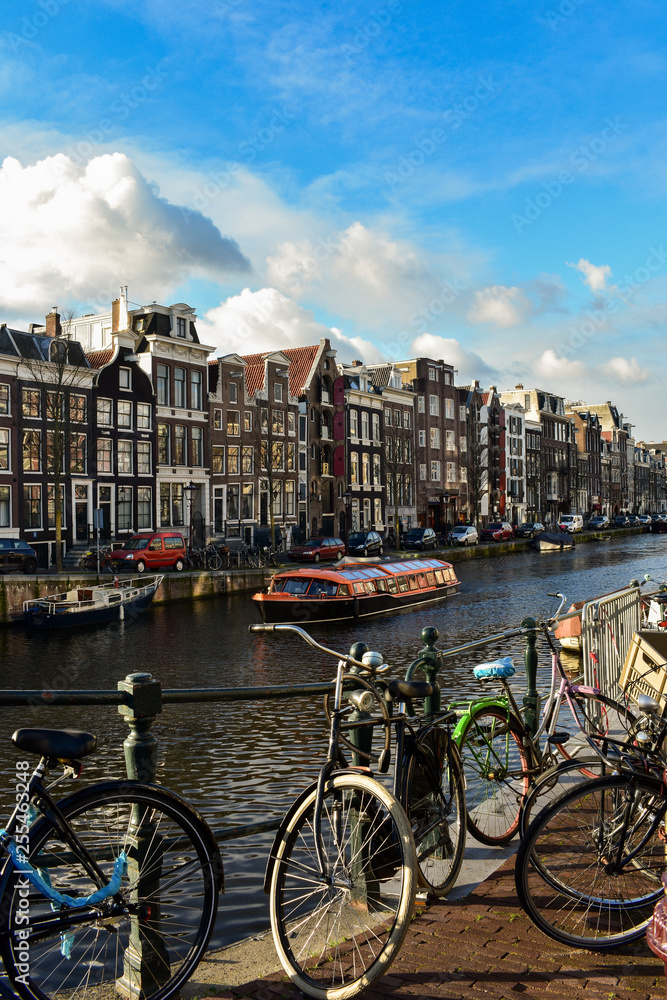 Traditional old buildings and and boats in Amsterdam, Netherland