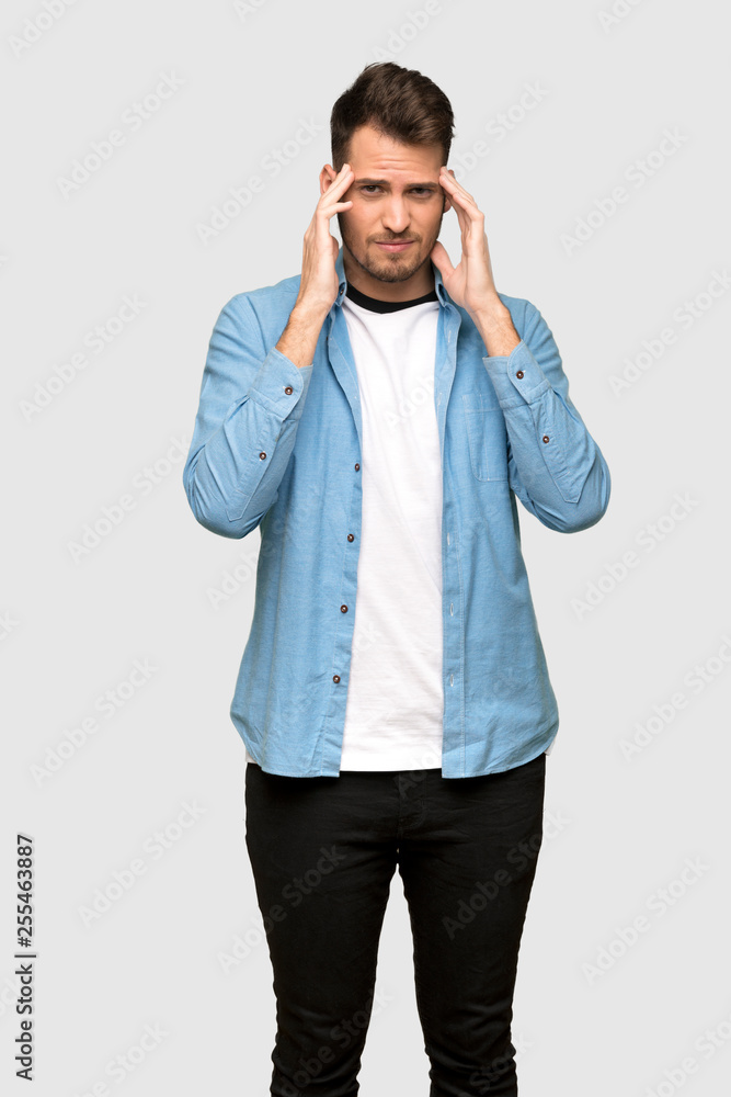 Handsome man with headache over grey background Handsome man with headache over grey background
