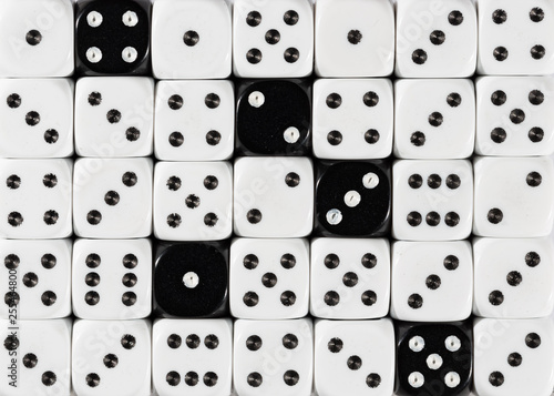 Background of random ordered white dices with five black cubes