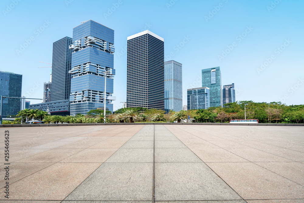 Urban skyscrapers with empty square floor tiles