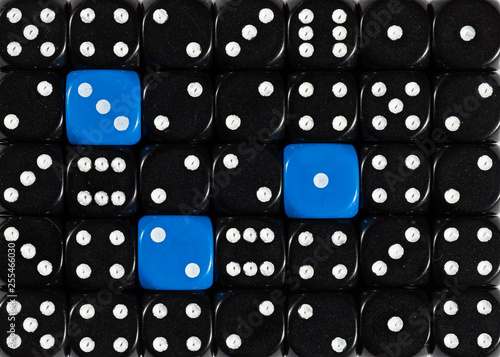 Background of random ordered black dices with three blue cubes