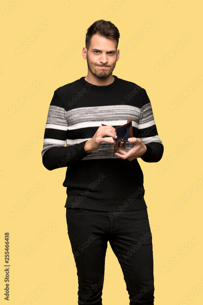 Handsome man holding a wallet Handsome man holding a wallet