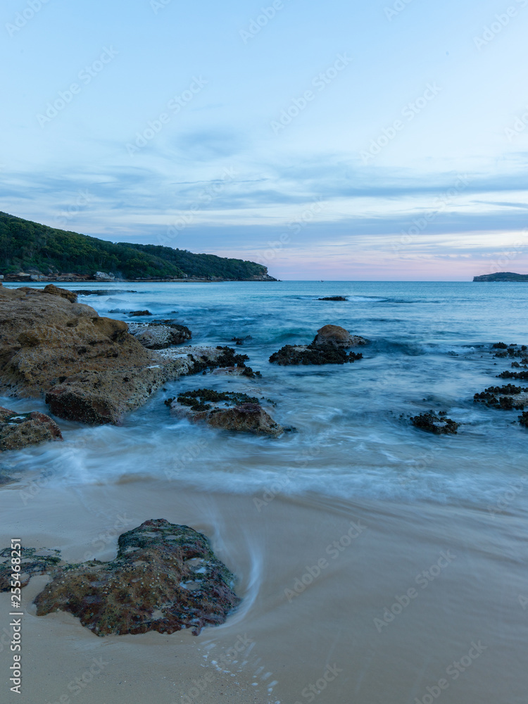 Water motion at the beach shore around the rocks. Water motion at the beach shore around the rocks.