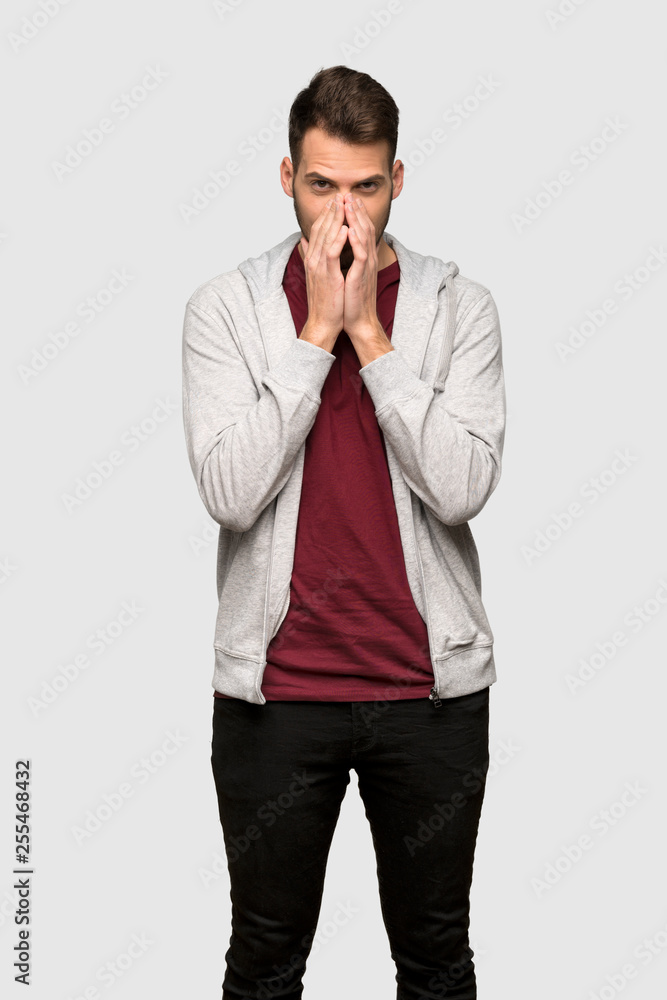 Man with sweatshirt smiling a lot over grey background Man with sweatshirt smiling a lot over grey background