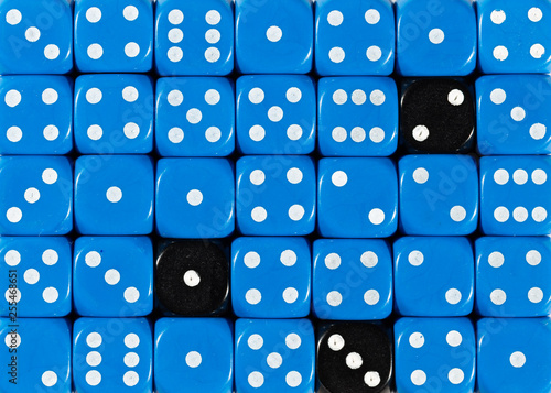 Background of random ordered blue dices with three black cubes