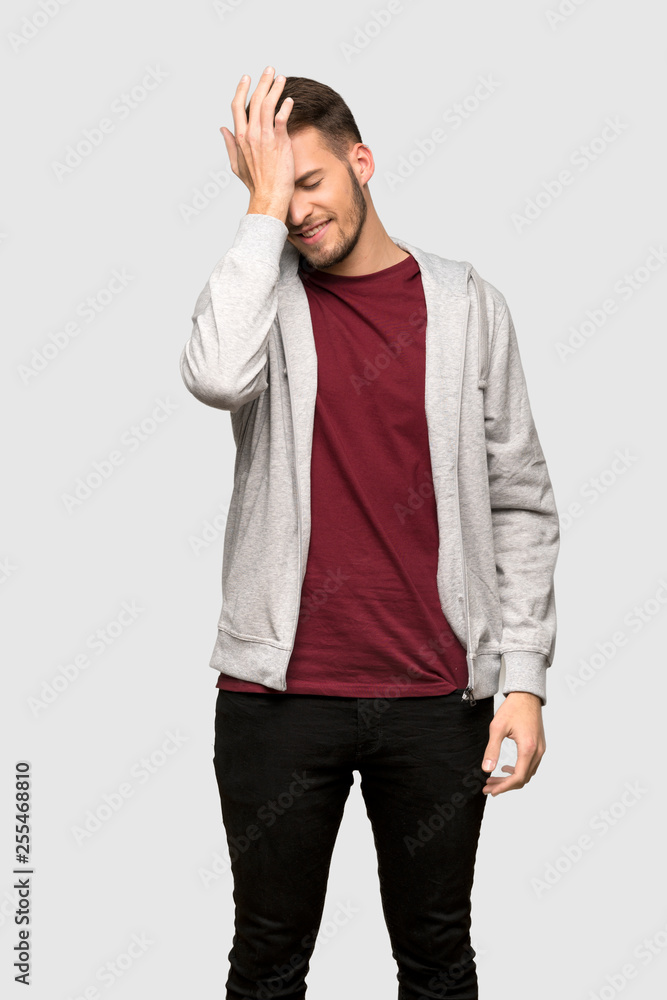 Fototapeta premium Man with sweatshirt has realized something and intending the solution over grey background