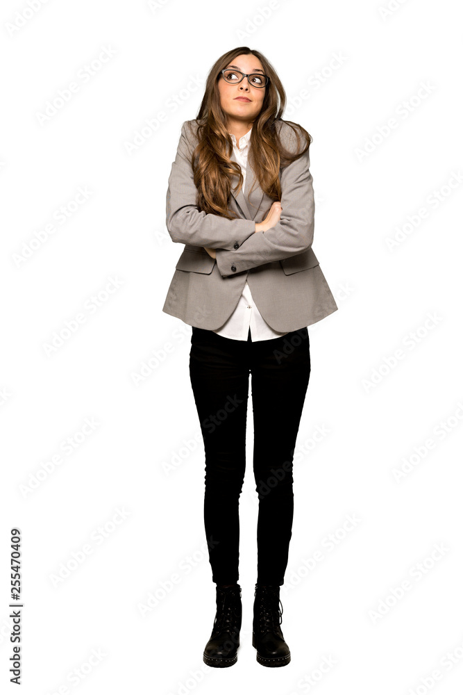 Full-length shot of Business woman making doubts gesture while lifting the shoulders on isolated white background Full-length shot of Business woman making doubts gesture while lifting the shoulders on isolated white background
