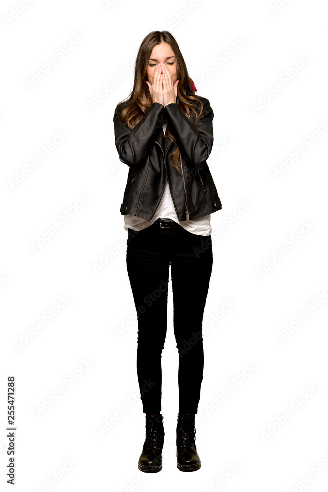 Full-length shot of Young woman with leather jacket smiling a lot on isolated white background Full-length shot of Young woman with leather jacket smiling a lot on isolated white background