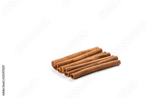 Four cinnamon sticks isolated on white background. Spice concept.