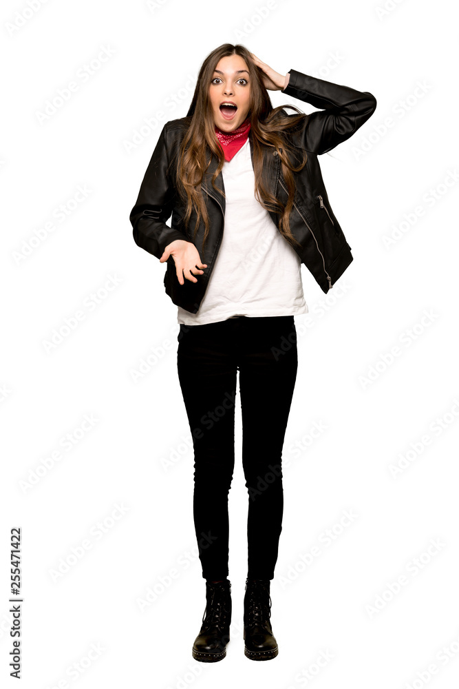 Full-length shot of Young woman with leather jacket with surprise and shocked facial expression on isolated white background Full-length shot of Young woman with leather jacket with surprise and shocked facial expression on isolated white background