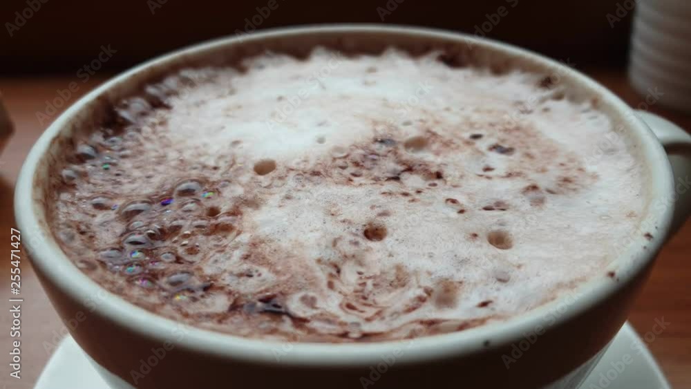 Close up of a cocoa cup with milk on the table. Close up of a cocoa cup with milk on the table.