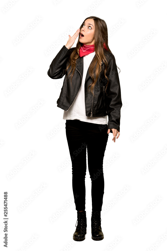 Full-length shot of Young woman with leather jacket yawning and covering wide open mouth with hand on isolated white background Full-length shot of Young woman with leather jacket yawning and covering wide open mouth with hand on isolated white background