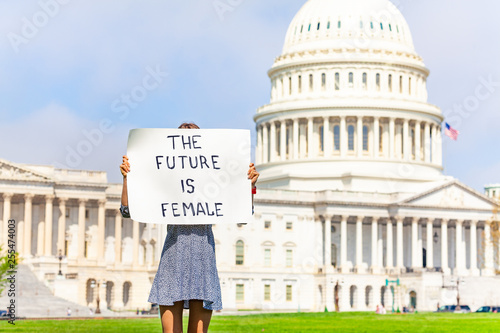 Protester holding feminist banner future is female photo