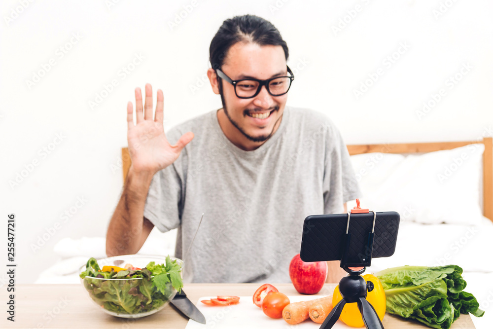 Asia man blogger in front of camera recording herself.social media concept Asia man blogger in front of camera recording herself.social media concept