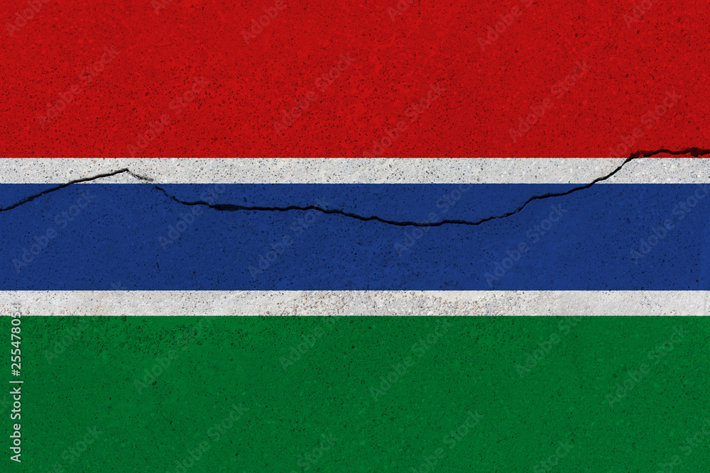 Gambia flag on concrete wall with crack Gambia flag on concrete wall with crack