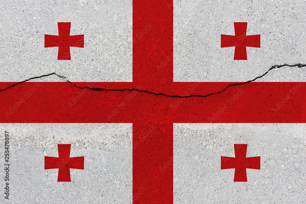 Georgia flag on concrete wall with crack Georgia flag on concrete wall with crack