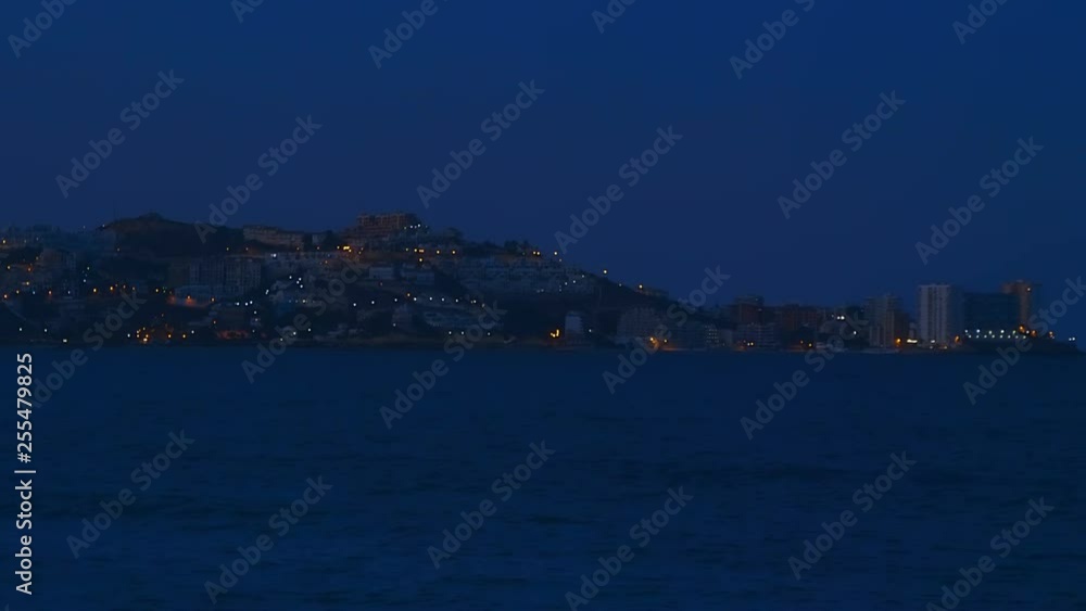Night lights of a small resort town on the Mediterranean coast in Spain Night lights of a small resort town on the Mediterranean coast in Spain