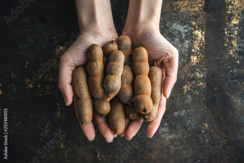 Fresh ripe tamarind on rustic background