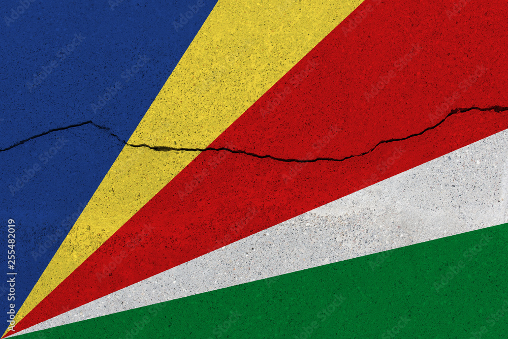 Seychelles flag on concrete wall with crack