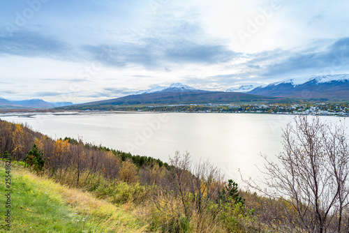 Beautiful scenery of Akureyri city from tourist viewpoint across the sea and Eyjafjordur fjord in iceland