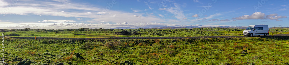 The Beautiful panorama view of blue sky and eldhraun lava field. The Green moss covered lava rock.