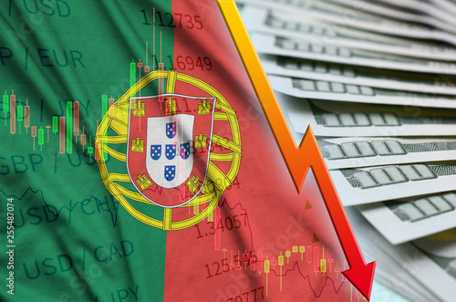 Portugal flag and chart falling US dollar position with a fan of dollar bills photo