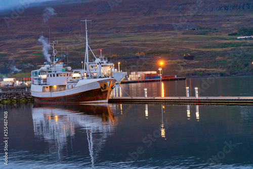 Fishing boat docking in port Akureyri city in Iceland