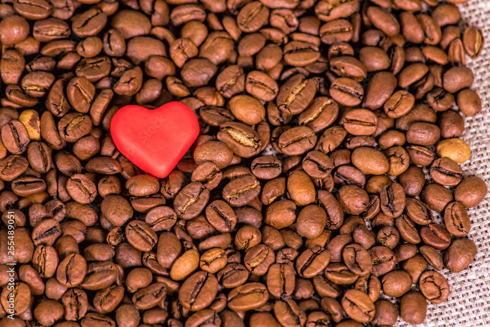 Coffee beans and a valentine symbol. Concept: loving coffee. Coffee beans and a valentine symbol. Concept: loving coffee.
