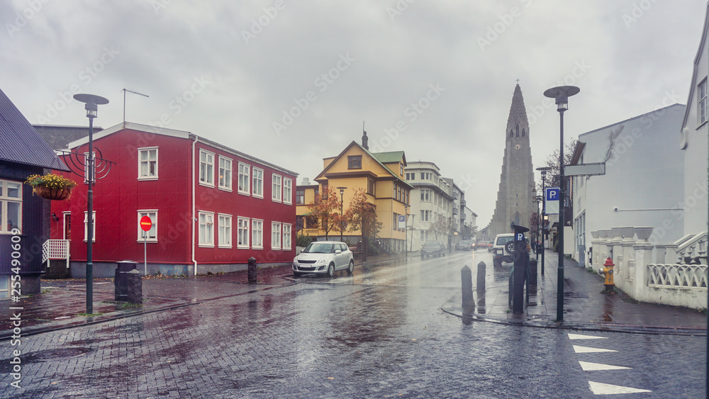 Beautiful Perspective street view from downtown to Hallgrimskirkja the modern cathedral this photo taken between rain storm, Reykjavik the capital of Iceland