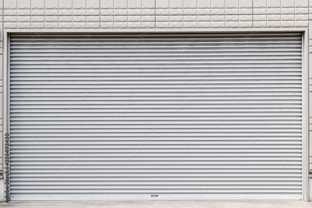 Fototapeta premium Steel roll doors in front of the store closed