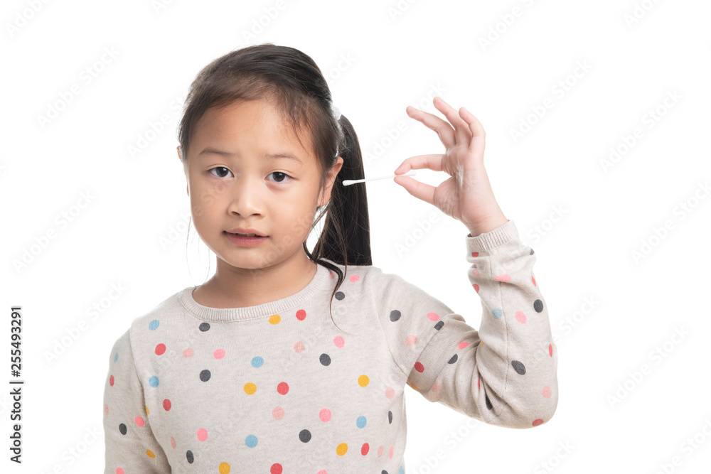Cute kid southeast asian girl age 7 years in acting with cotton bud isolated on white