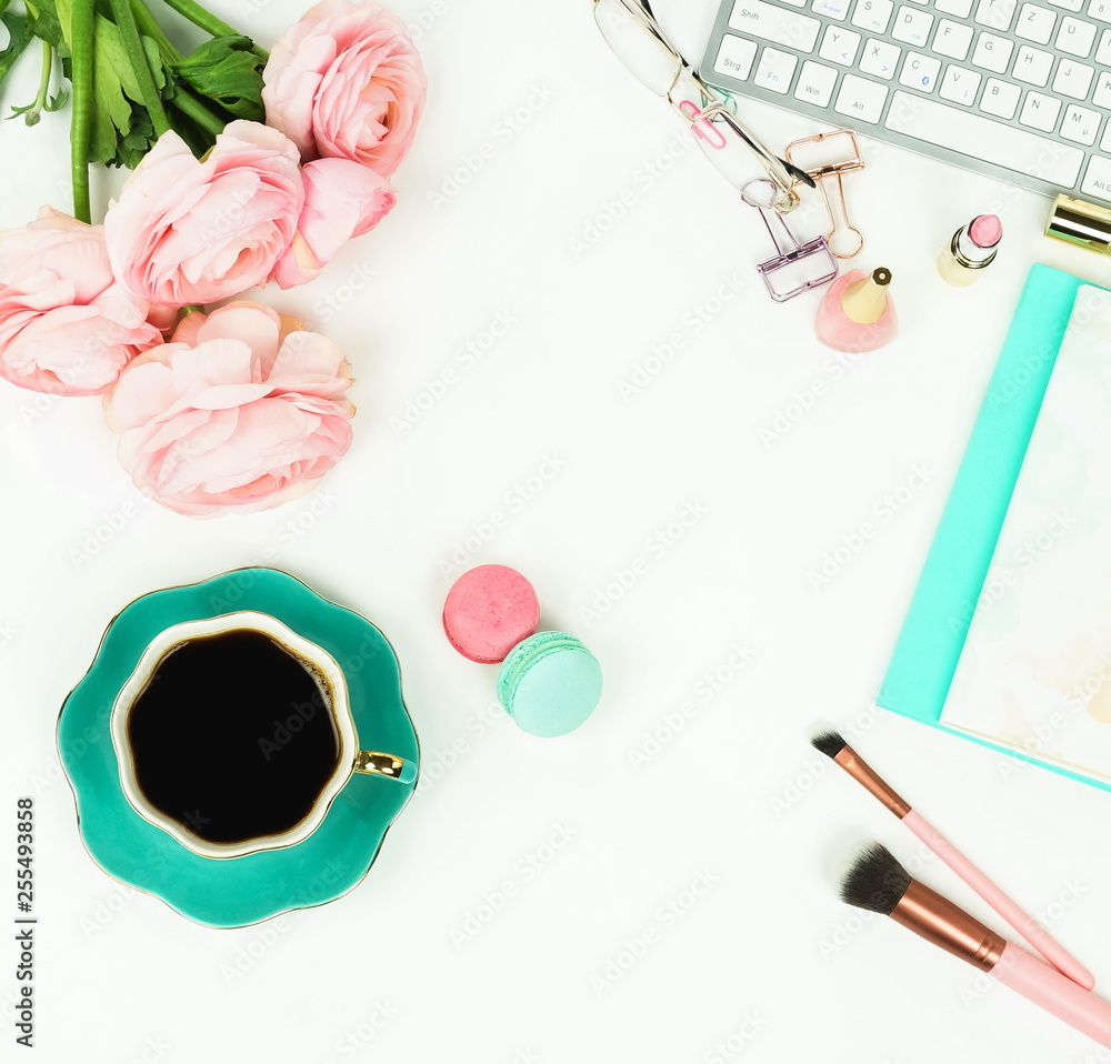 Flat lay women's office desk. Female workspace with laptop, flowers pink ranunkulus, accessories, notebooks, glasses, cup of coffee on white background. Top view feminine background.Copy space. Flat lay women's office desk. Female workspace with laptop, flowers pink ranunkulus, accessories, notebooks, glasses, cup of coffee on white background. Top view feminine background.Copy space.