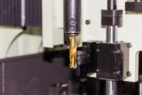 close up insert carbide at end of drill bit at automatic drilling machine at workshop