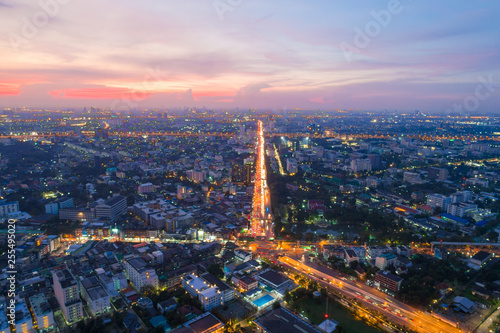 Aerial view sunset in Bangkok city building with city transport road
