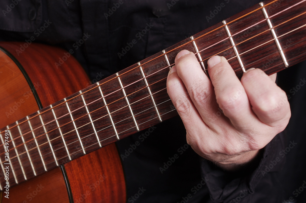 Guitarist playing guitar. Close-up Guitarist playing guitar. Close-up