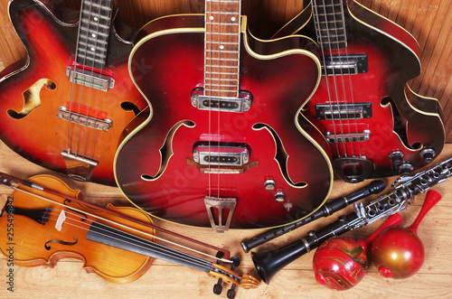 Three electric guitars, violin, maracas, djembe