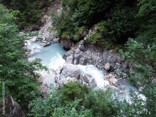 A canyon of brooks Chärstelenbach or Bristentobel gorge - Canton of Uri, Switzerland photo