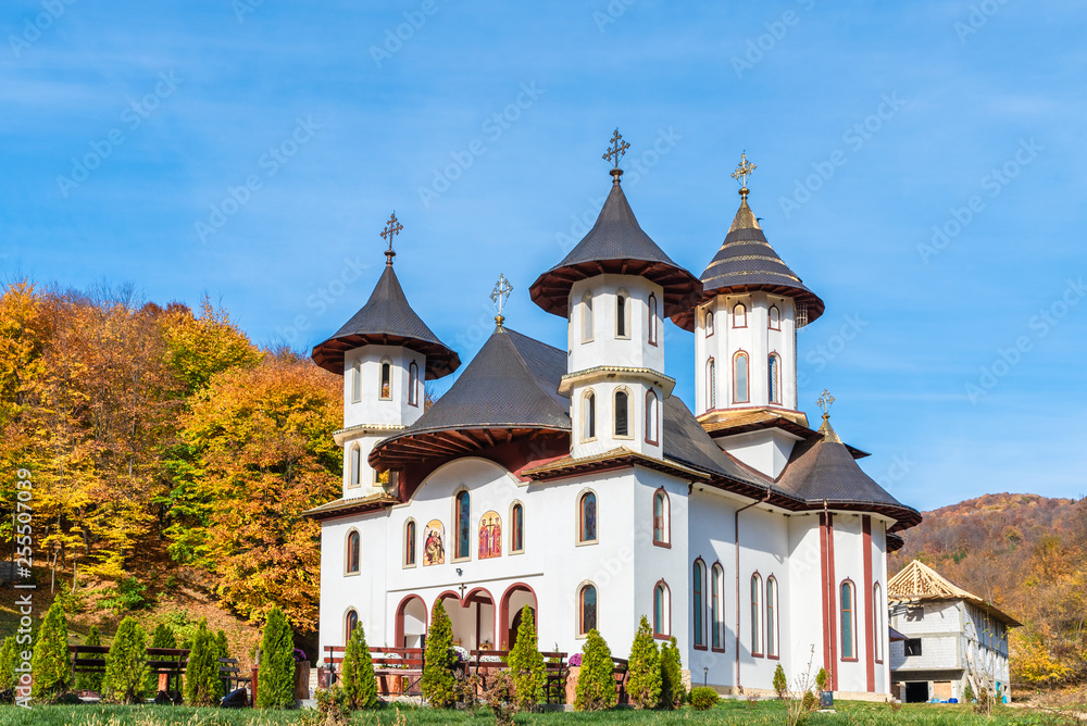 Codreanu monastery on the Oituz valley at autumn season, Moldavia, Romania