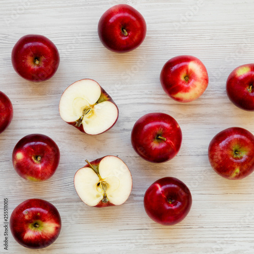 Raw red apples on white wooden surface, overhead view. Flat lay, from above, top view. Closeup.